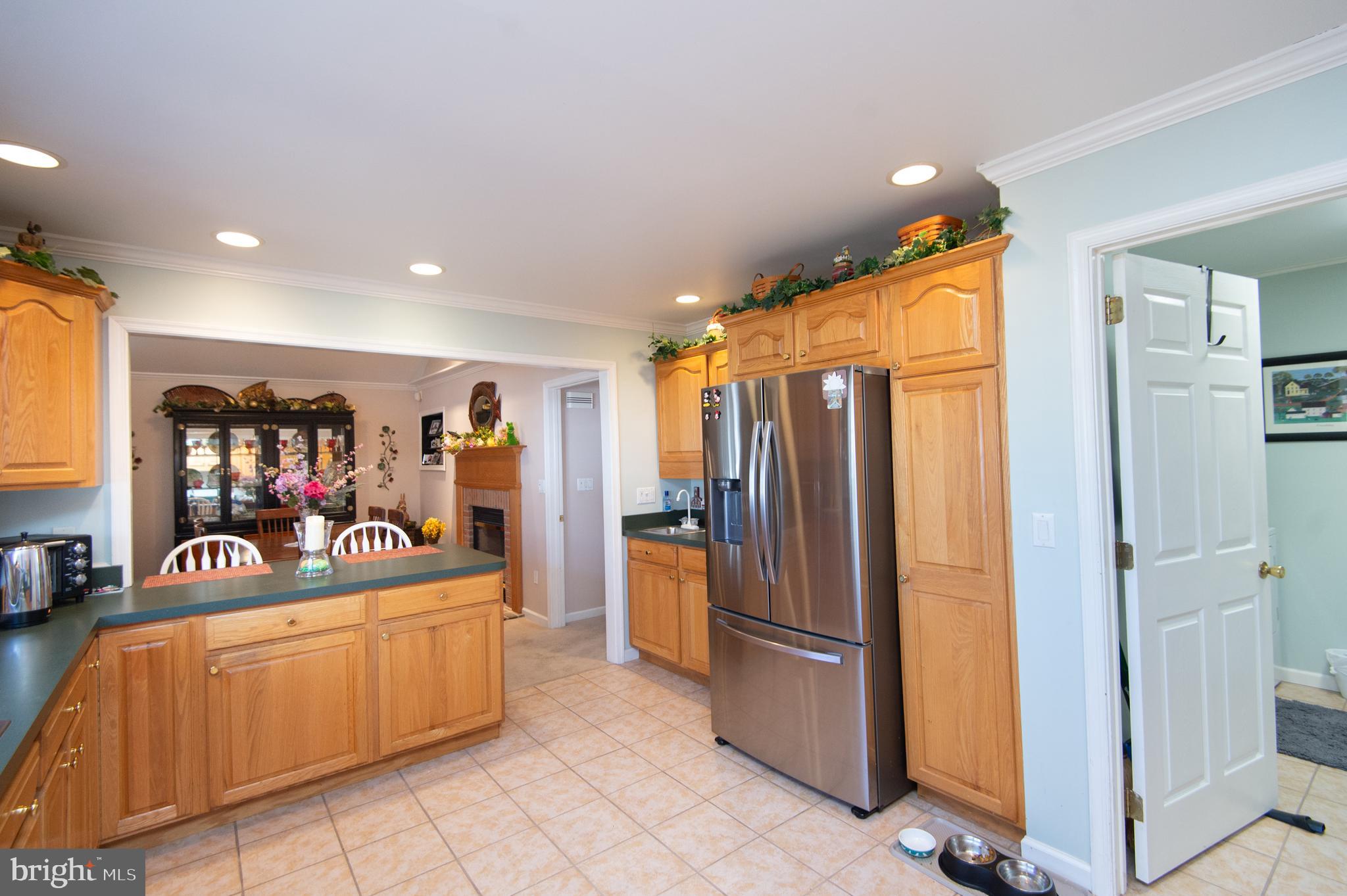 9 Holly Terrace Cambridge, MD 21613 - Photo 18 of 49 a bed room with a bed and a refrigerator