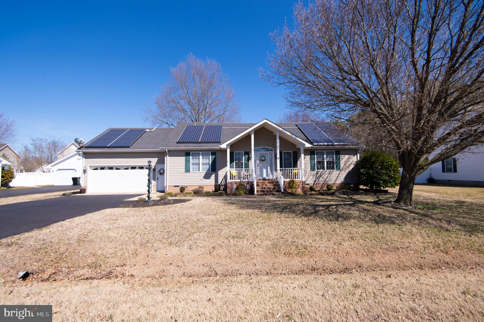 9 Holly Terrace Cambridge, MD 21613 - Photo 2 of 49 a front view of a house with a yard