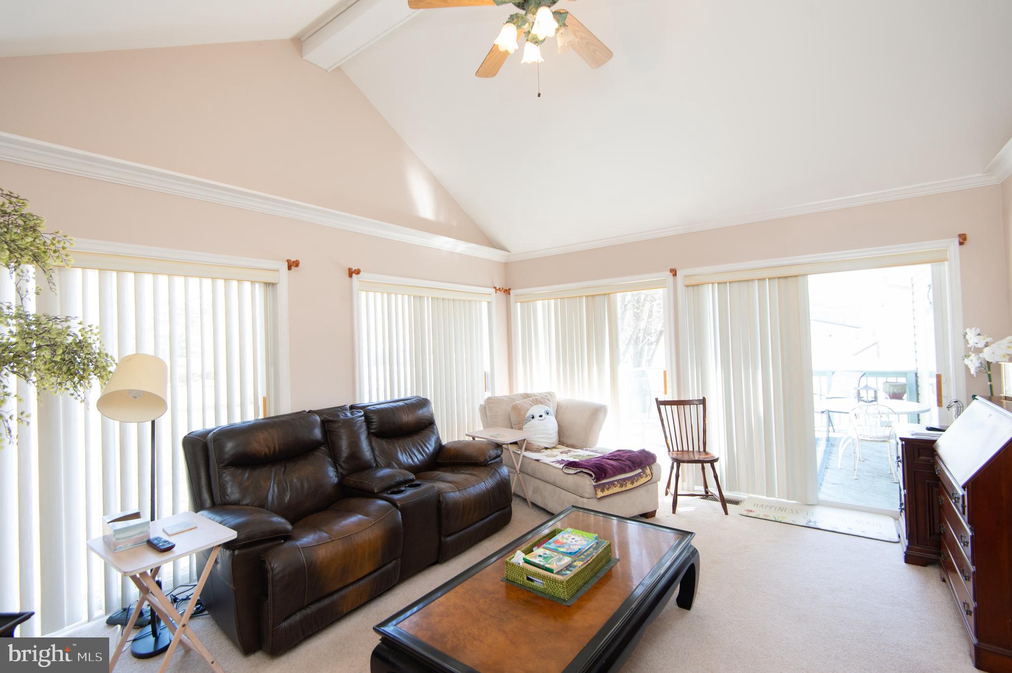 9 Holly Terrace Cambridge, MD 21613 - Photo 25 of 49 a living room with furniture and a large window