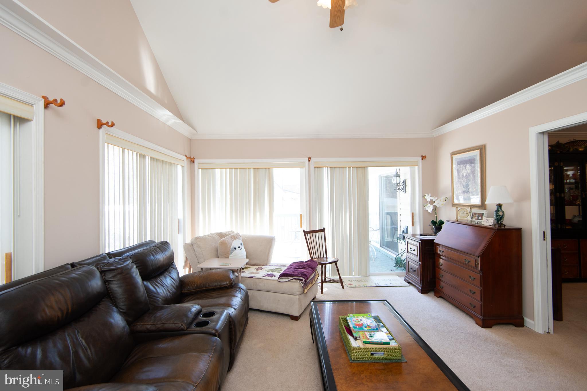 9 Holly Terrace Cambridge, MD 21613 - Photo 26 of 49 a living room with furniture and a window