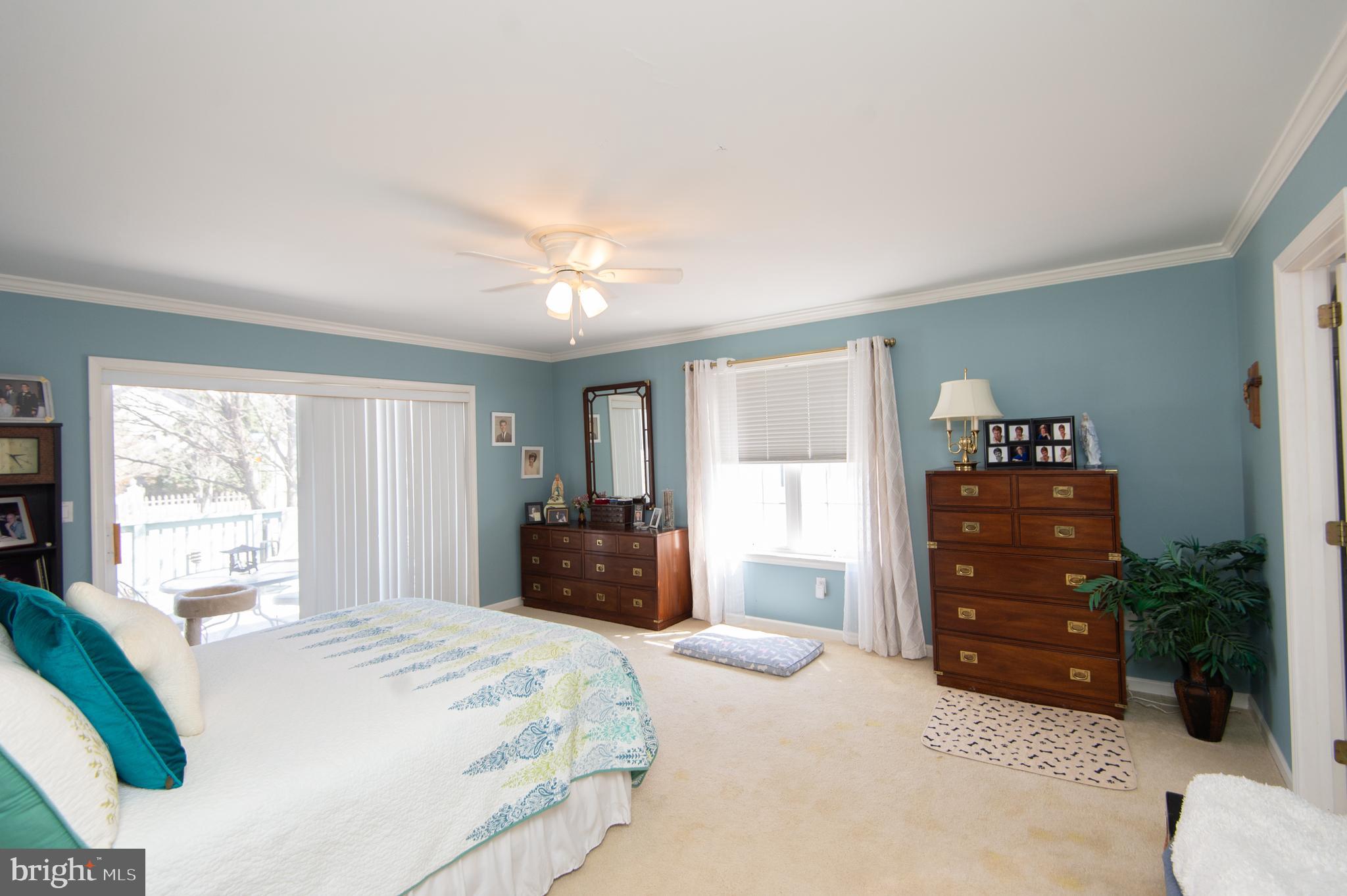 9 Holly Terrace Cambridge, MD 21613 - Photo 28 of 49 a bedroom with a bed and a dresser
