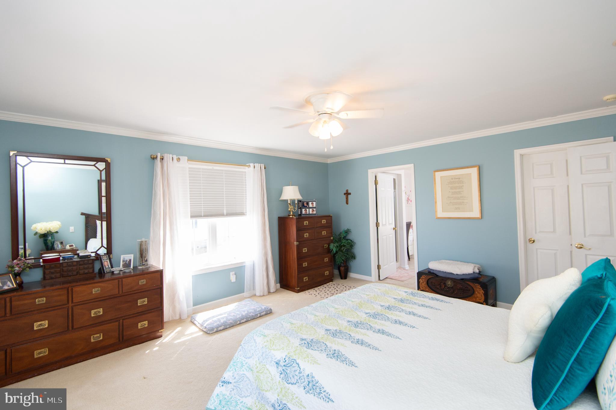 9 Holly Terrace Cambridge, MD 21613 - Photo 31 of 49 a bedroom with a bed and a dresser