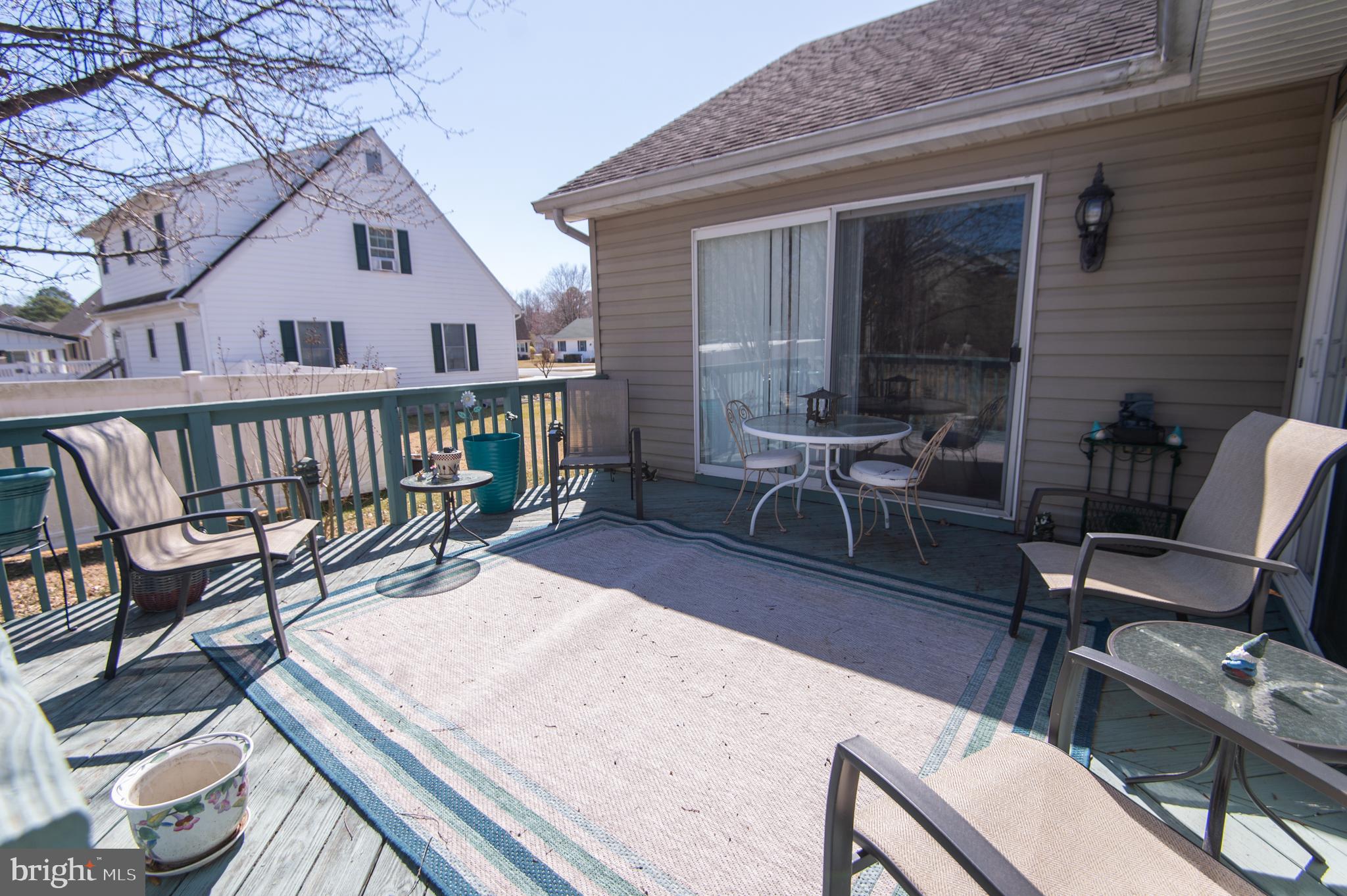 9 Holly Terrace Cambridge, MD 21613 - Photo 45 of 49 a view of a patio with a table chairs and backyard