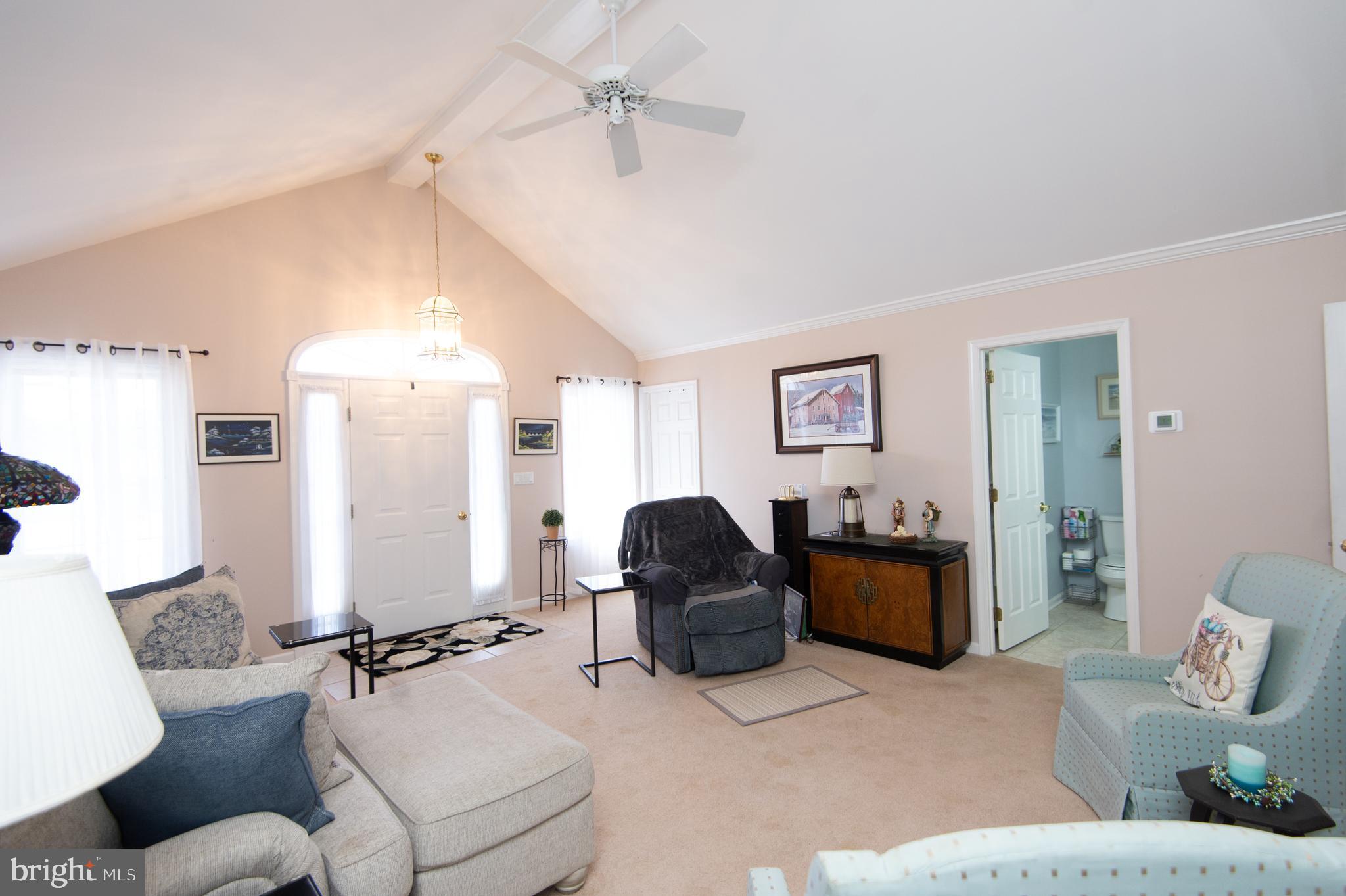9 Holly Terrace Cambridge, MD 21613 - Photo 8 of 49 a living room with furniture and wooden floor