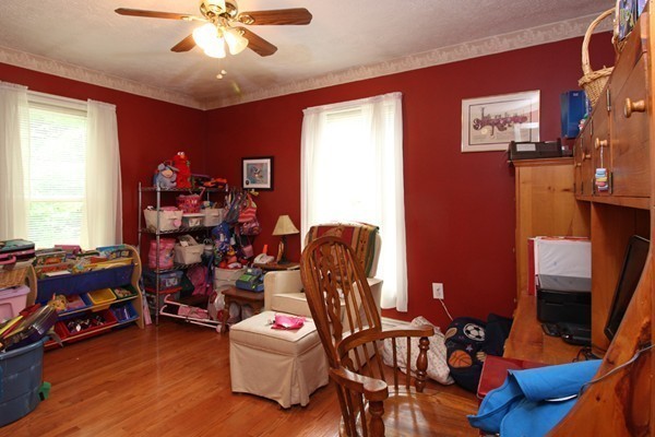 873 Erickson Road Ashby, MA 01431 - Photo 12 of 17 a room with furniture and wooden floor