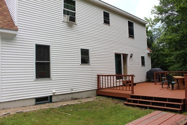 873 Erickson Road Ashby, MA 01431 - Photo 14 of 17 a view of a white house with a roof deck