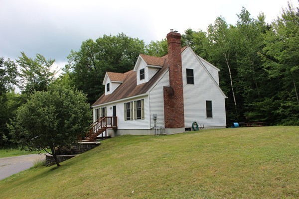 873 Erickson Road Ashby, MA 01431 - Photo 17 of 17 a view of a house with backyard and sitting area