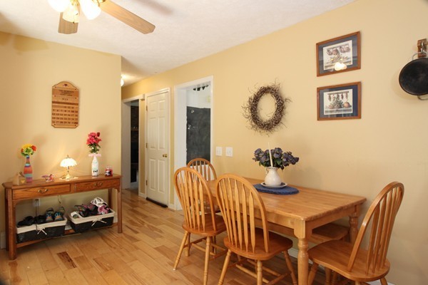 873 Erickson Road Ashby, MA 01431 - Photo 3 of 17 a dining room with furniture and a floor to ceiling window