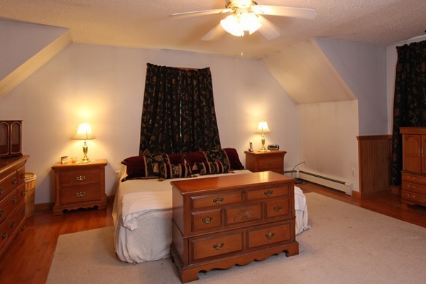 873 Erickson Road Ashby, MA 01431 - Photo 7 of 17 a room with furniture and a flat screen tv