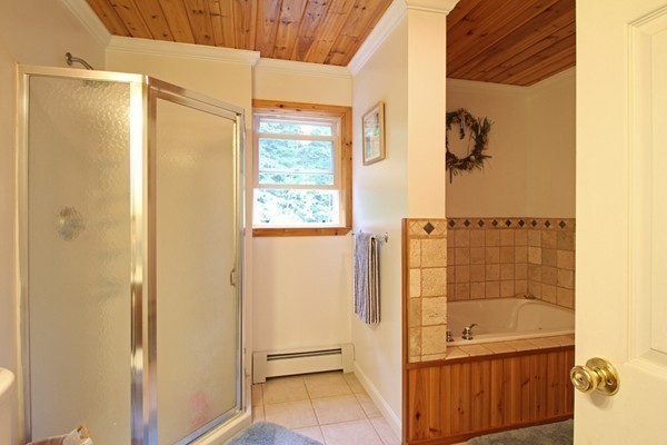 873 Erickson Road Ashby, MA 01431 - Photo 8 of 17 a bathroom with a bathtub and a shower