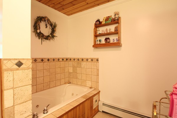 873 Erickson Road Ashby, MA 01431 - Photo 9 of 17 a bathroom with a bathtub and shower