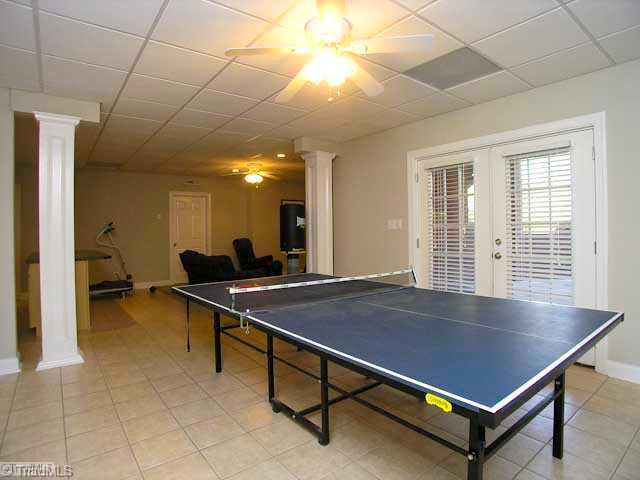 4137 Gumtree Road Winston-Salem, NC 27107 - Photo 13 of 16 Game. This home is made to entertain! In addition to the home theatre (not shown) there is a game room that leads to a covered patio!