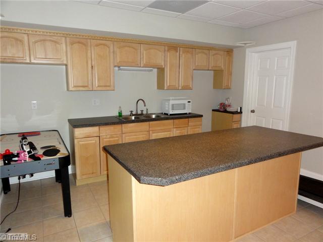 4137 Gumtree Road Winston-Salem, NC 27107 - Photo 14 of 16 Kitchen. The basement of this home was made to be used as an in-law or teen suite! The spacious kitchen and full bath (not shown) lend themselves to easy living!