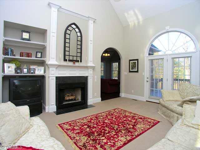 4137 Gumtree Road Winston-Salem, NC 27107 - Photo 4 of 16 Living Room. The soaring ceilings in the living room are just one of the things you ll love about this room! Also notice the fireplace, built in shelving, and French doors that lead to the deck!
