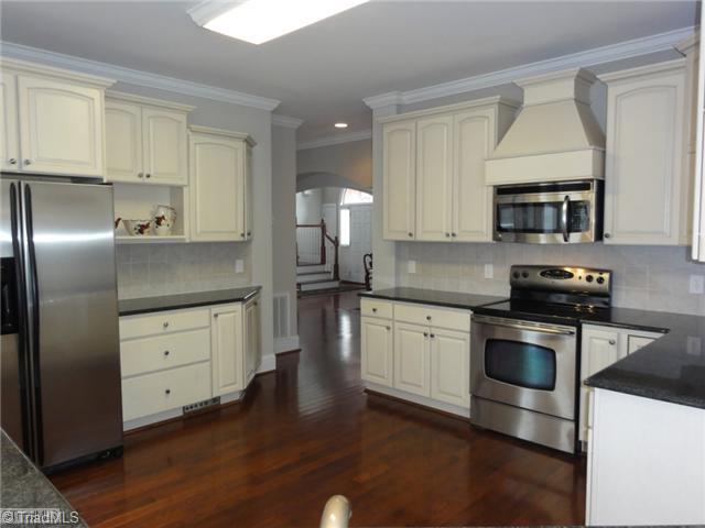4137 Gumtree Road Winston-Salem, NC 27107 - Photo 5 of 16 Kitchen. A dream kitchen! Tons of cabinet and counter space, huge walk-in pantry, gorgeous cream cabinetry, and stainless appliances!