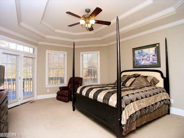 4137 Gumtree Road Winston-Salem, NC 27107 - Photo 8 of 16 Master Bedroom. The main level master is spacious, with multiple walk in closets and private access to the deck. Notice the ceiling detail!