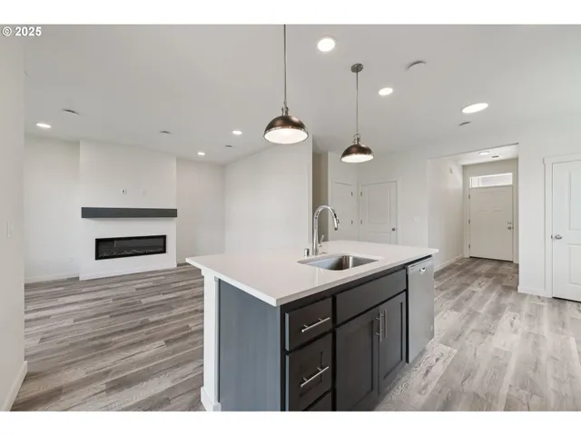 a kitchen with a sink and stove