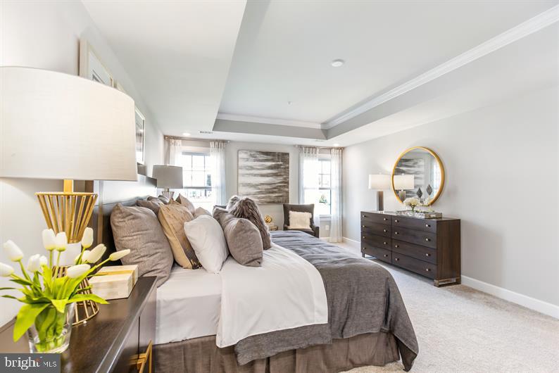174 Rehoboth Road Wayne, PA 19087 - Photo 16 of 18 a bedroom with a bed and ceiling fan