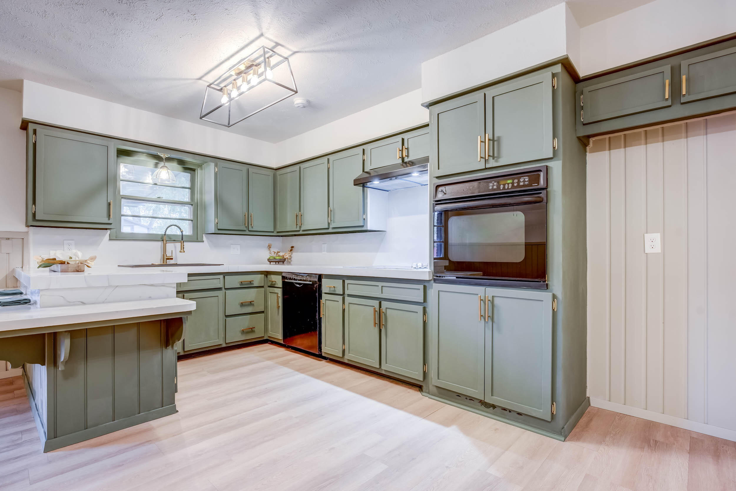 2101 64th Street Lubbock, TX 79412 - Photo 3 of 30 a kitchen with a sink stove and microwave