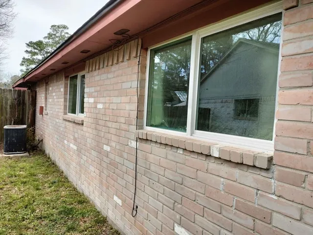a view of house with backyard
