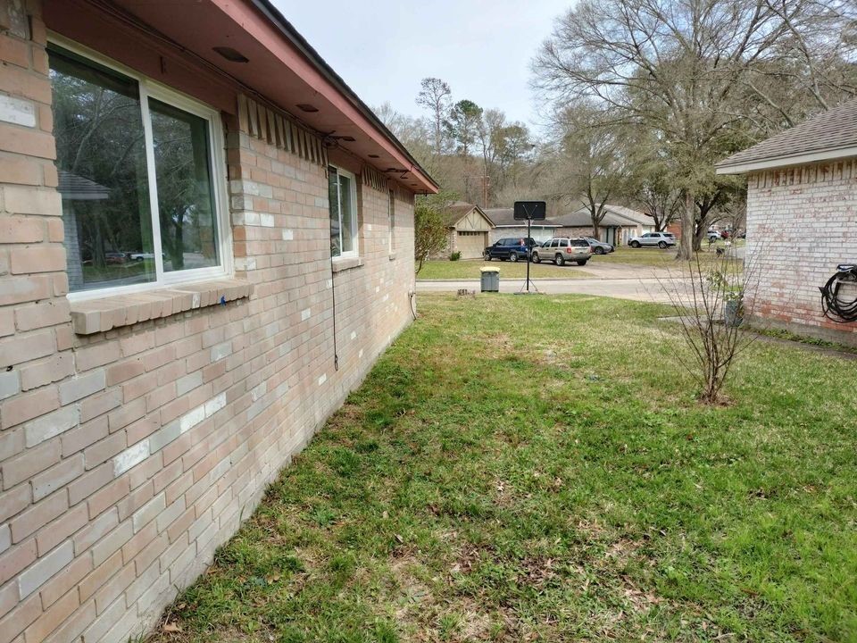23407 Little Wind Lane Spring, TX 77373 - Photo 4 of 7 a backyard of a house with table and chairs