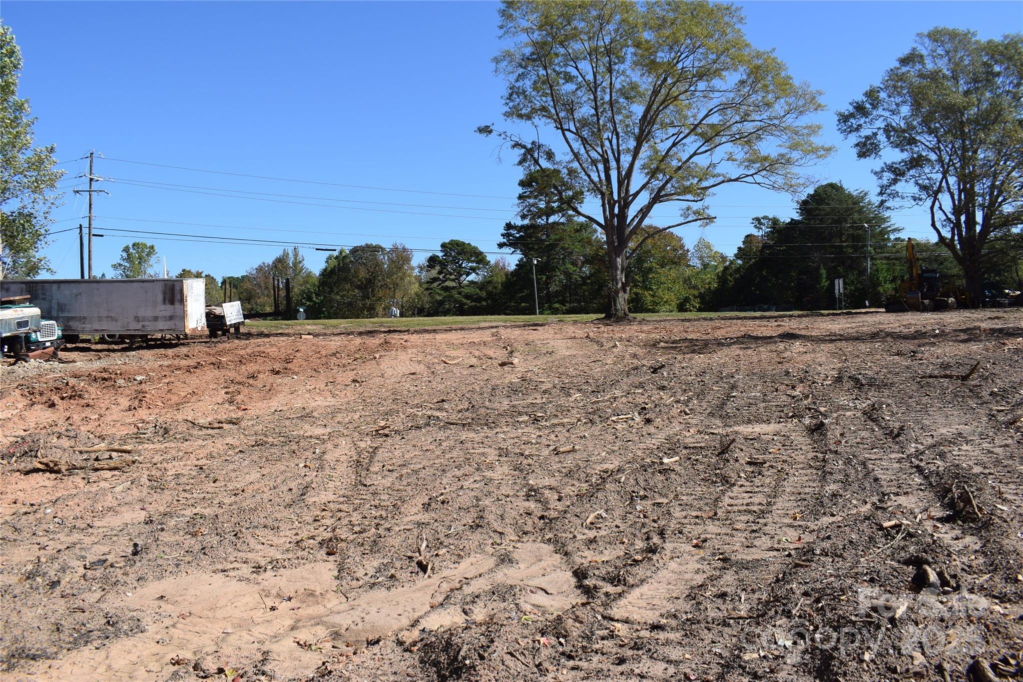 102 Horton Road, Unit LOT A Campobello, SC 29356 - Photo 6 of 22 a view of dirt yard with large trees