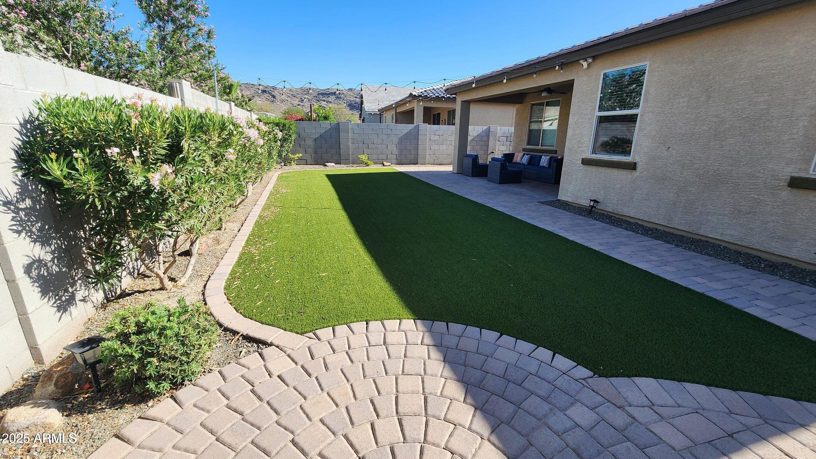 7925 South 24th Way Phoenix, AZ 85042 - Photo 17 of 19 a view of back yard of the house