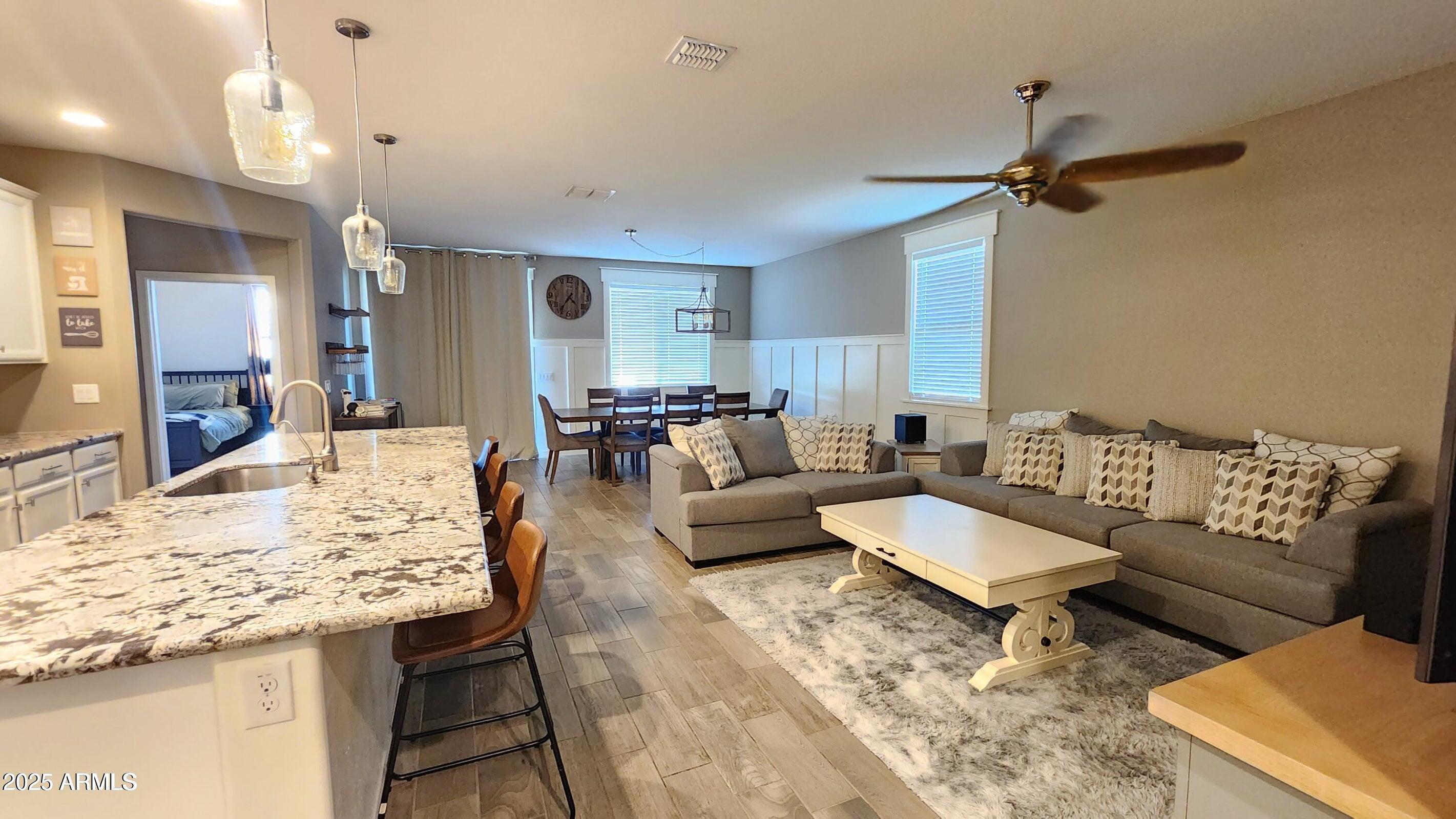 7925 South 24th Way Phoenix, AZ 85042 - Photo 8 of 19 a living room with furniture and a table