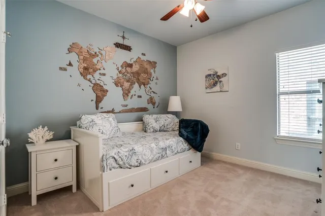 a bedroom with bed and window