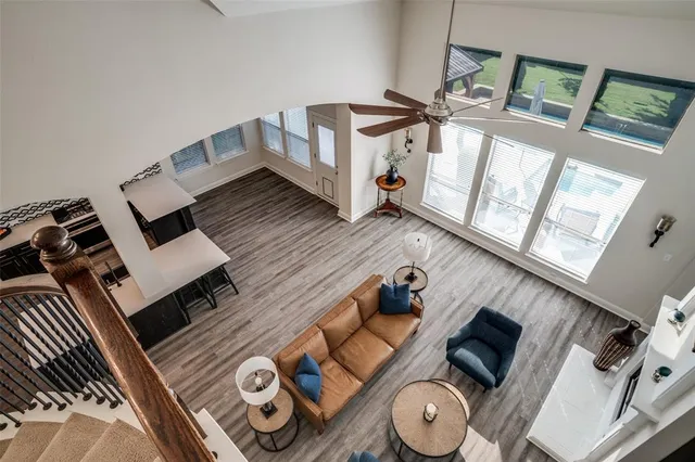 a view of living room with furniture and a fireplace