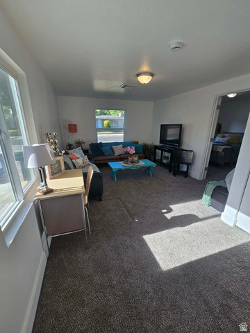 259 14th Street Ogden, UT 84404 - Photo 6 of 21 Spacious interior featuring neutral carpeting and white walls