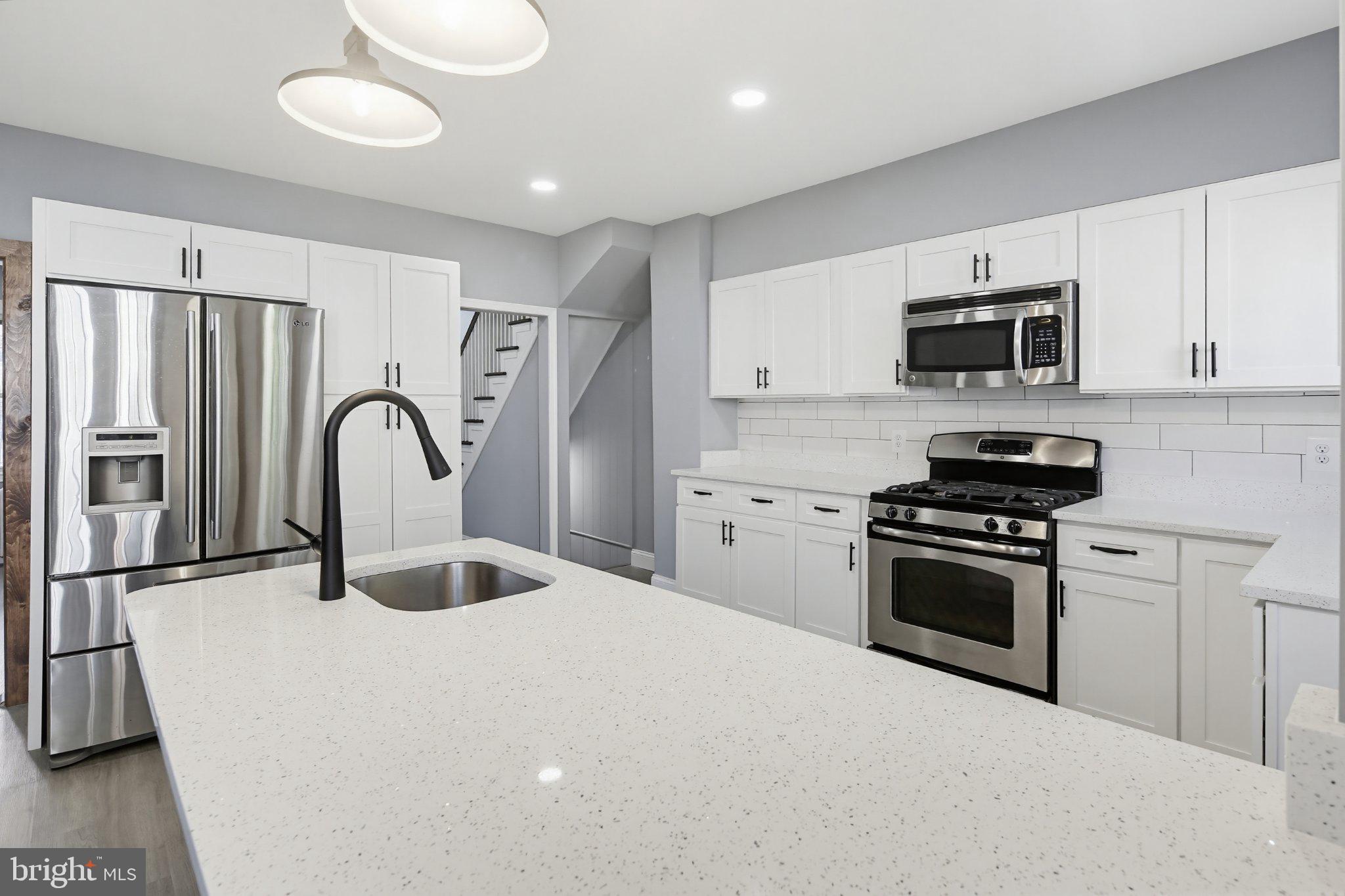 12 North Rosedale Street Baltimore, MD 21229 - Photo 3 of 25 Modern kitchen with sleek finishes.