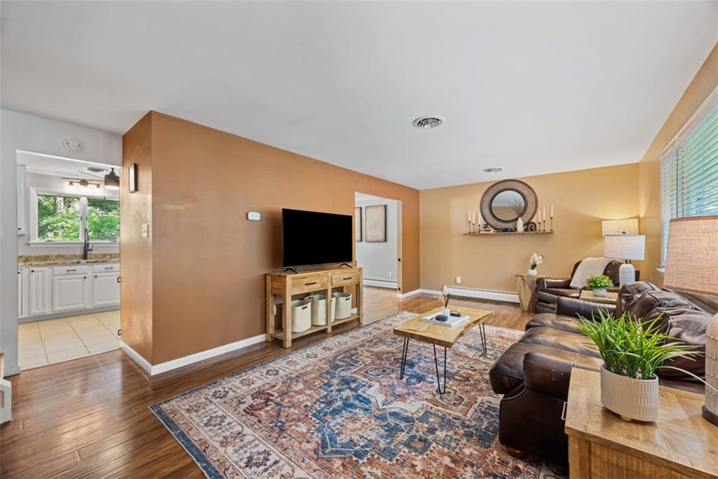 124 Heath Drive Baden, PA 15005 - Photo 11 of 42 a living room with furniture and a flat screen tv