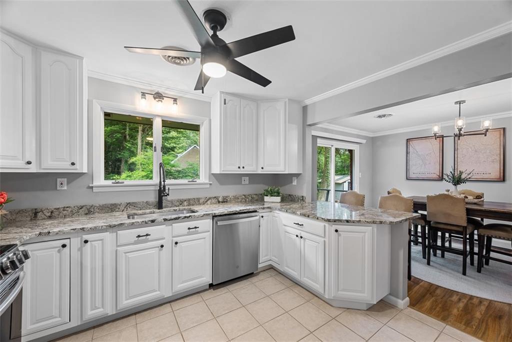 124 Heath Drive Baden, PA 15005 - Photo 16 of 42 a kitchen with a sink window and cabinets