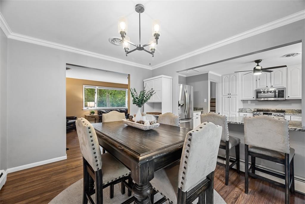 124 Heath Drive Baden, PA 15005 - Photo 20 of 42 a view of a dining room with furniture window and wooden floor