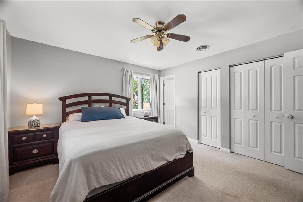 124 Heath Drive Baden, PA 15005 - Photo 23 of 42 a bedroom with a bed and a ceiling fan