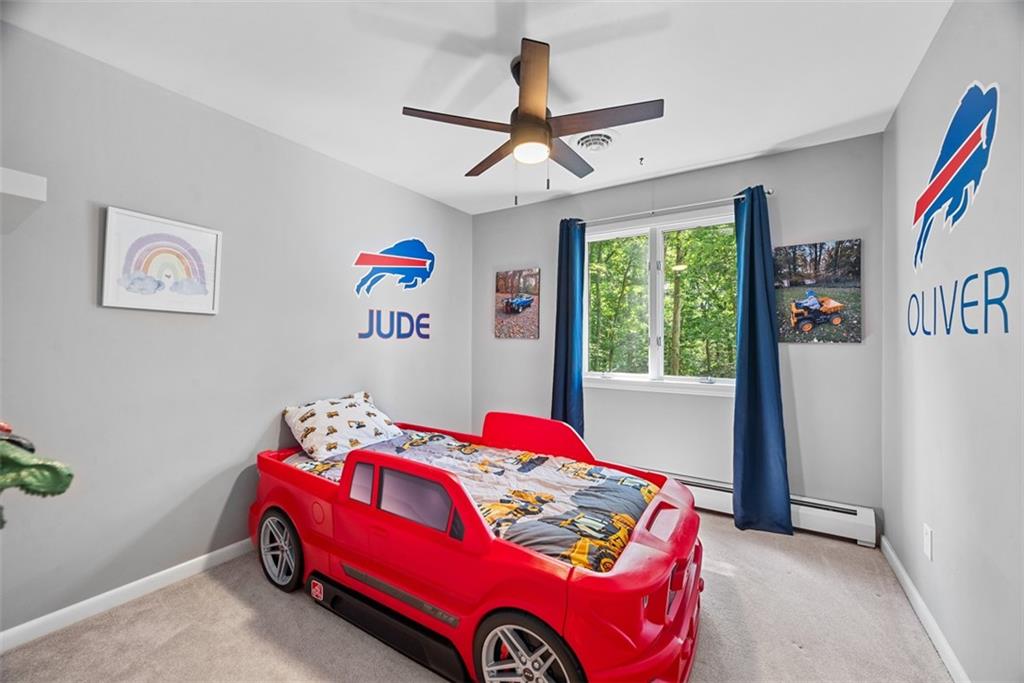 124 Heath Drive Baden, PA 15005 - Photo 25 of 42 a bedroom with a bed and a chandelier