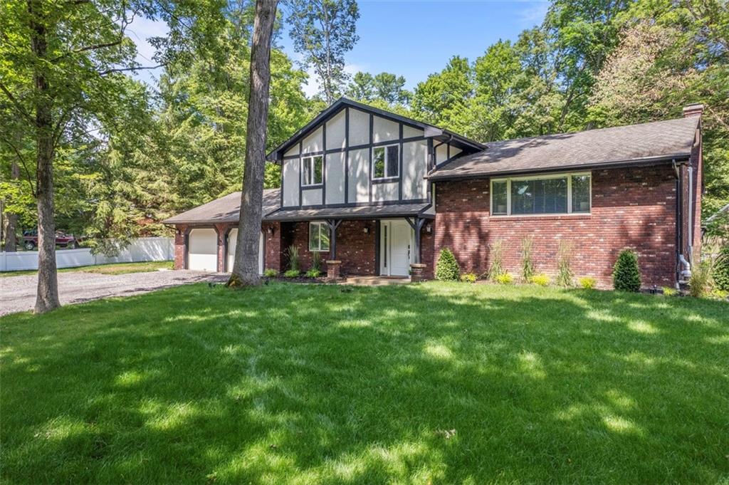 124 Heath Drive Baden, PA 15005 - Photo 3 of 42 a view of a yard in front of a house with large tree