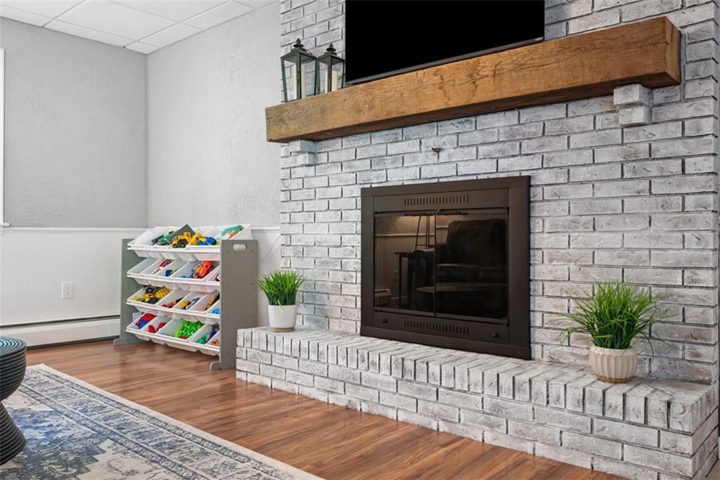 124 Heath Drive Baden, PA 15005 - Photo 31 of 42 a living room with furniture and a fireplace