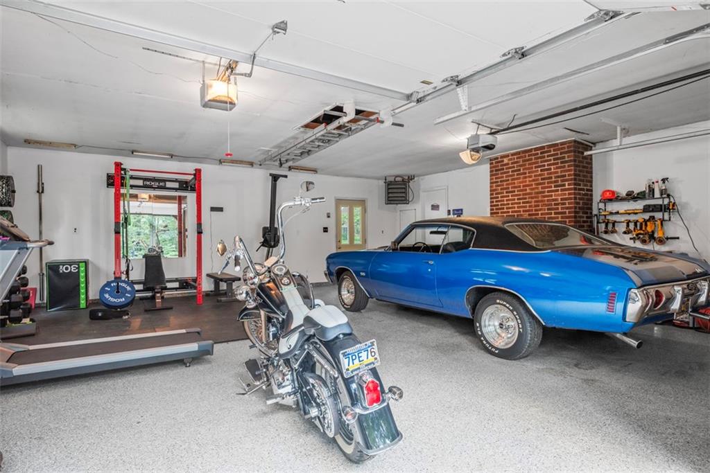 124 Heath Drive Baden, PA 15005 - Photo 33 of 42 a view of a garage with a car and car