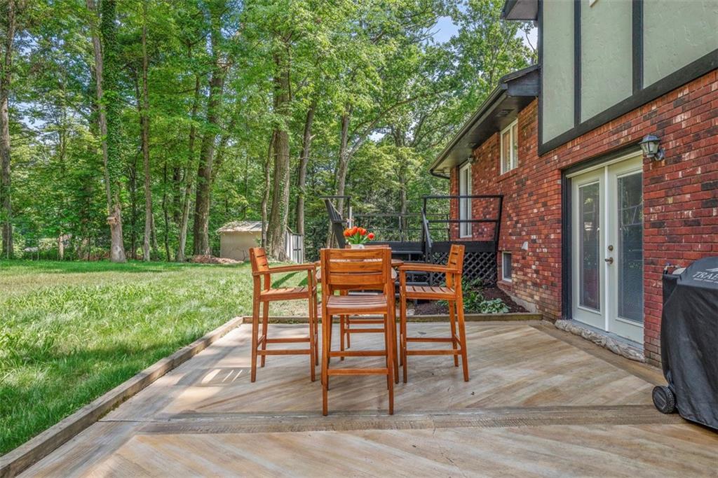 124 Heath Drive Baden, PA 15005 - Photo 35 of 42 a wooden bench sitting in front of a house