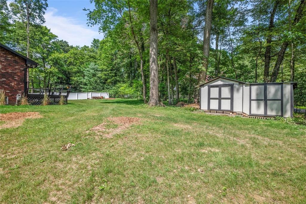 124 Heath Drive Baden, PA 15005 - Photo 39 of 42 a view of a house with a big yard and large trees