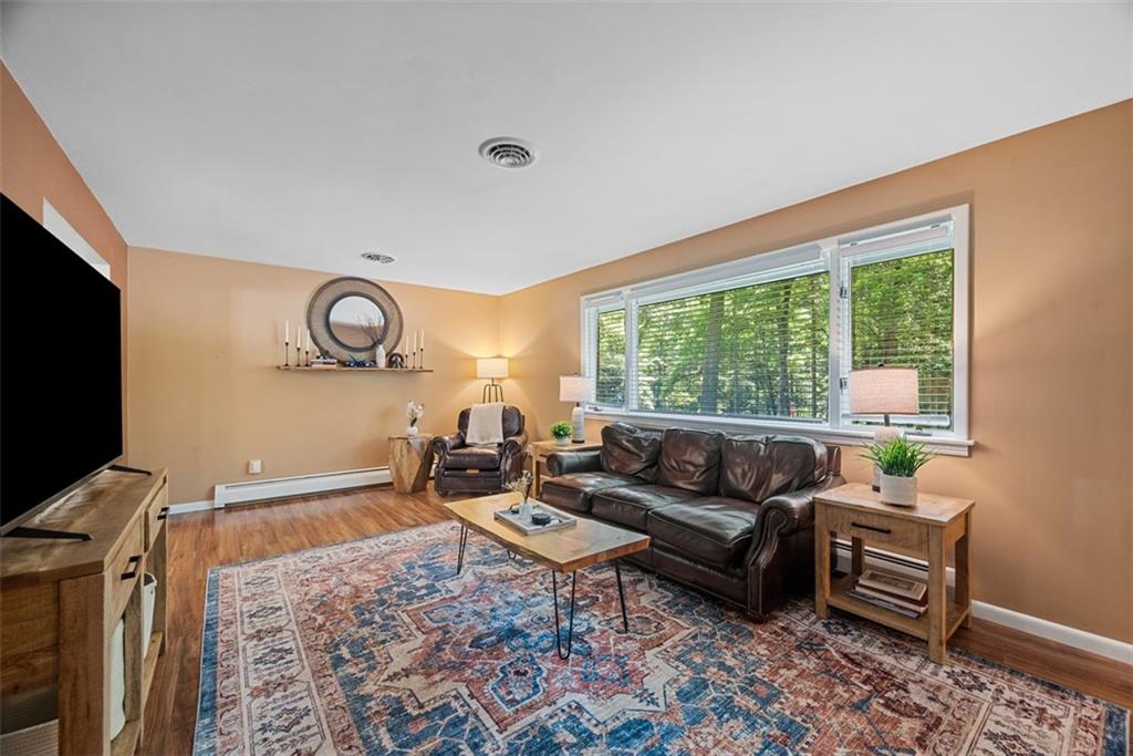 124 Heath Drive Baden, PA 15005 - Photo 9 of 42 a living room with furniture and a flat screen tv