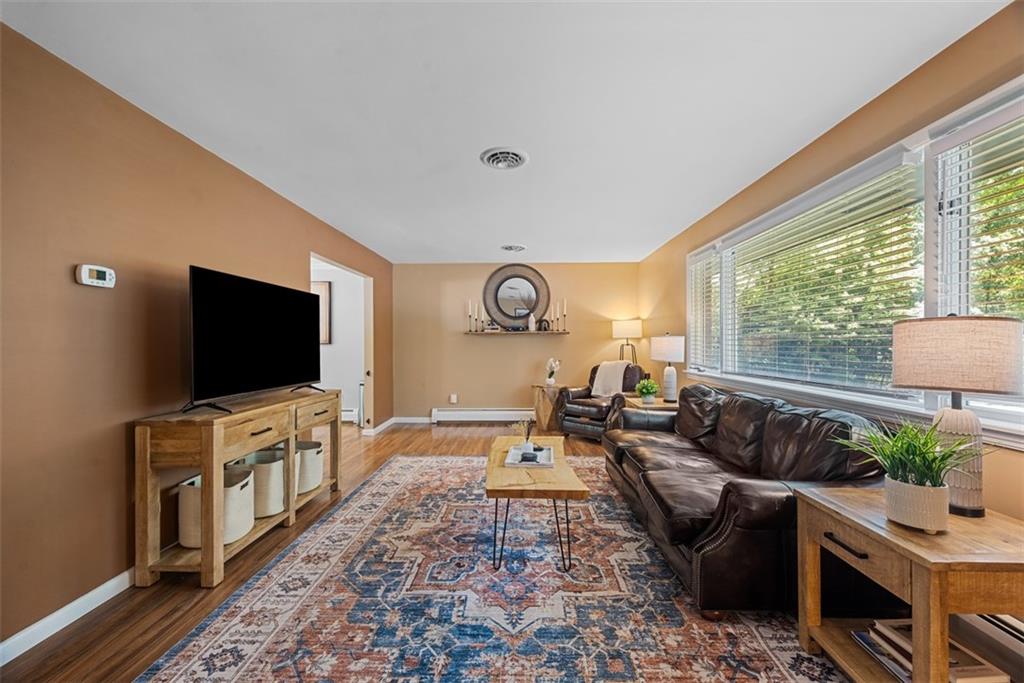 124 Heath Drive Baden, PA 15005 - Photo 10 of 42 a living room with furniture and a flat screen tv