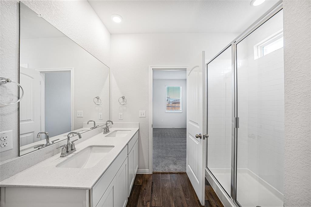 121 Mackinac Lane Georgetown, TX 78626 - Photo 8 of 16 a bathroom with a double vanity sink a and mirror