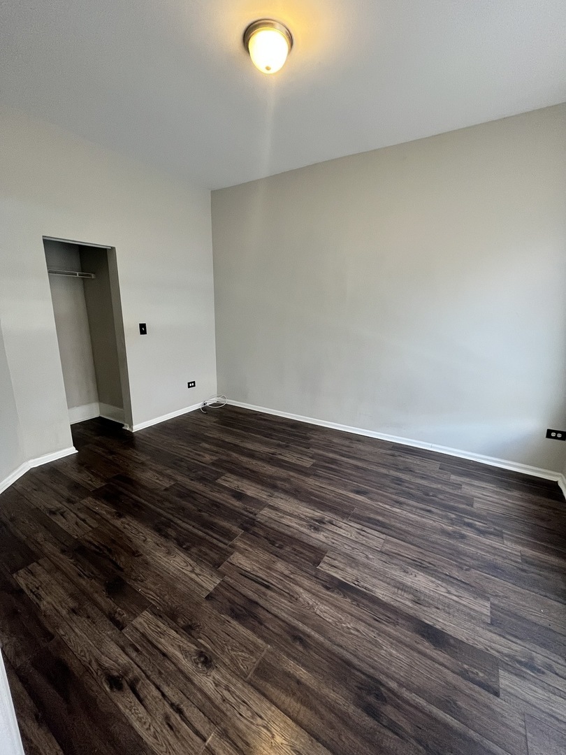 847 East 65th Street, Unit 2 Chicago, IL 60637 - Photo 5 of 13 a view of room with wooden floor
