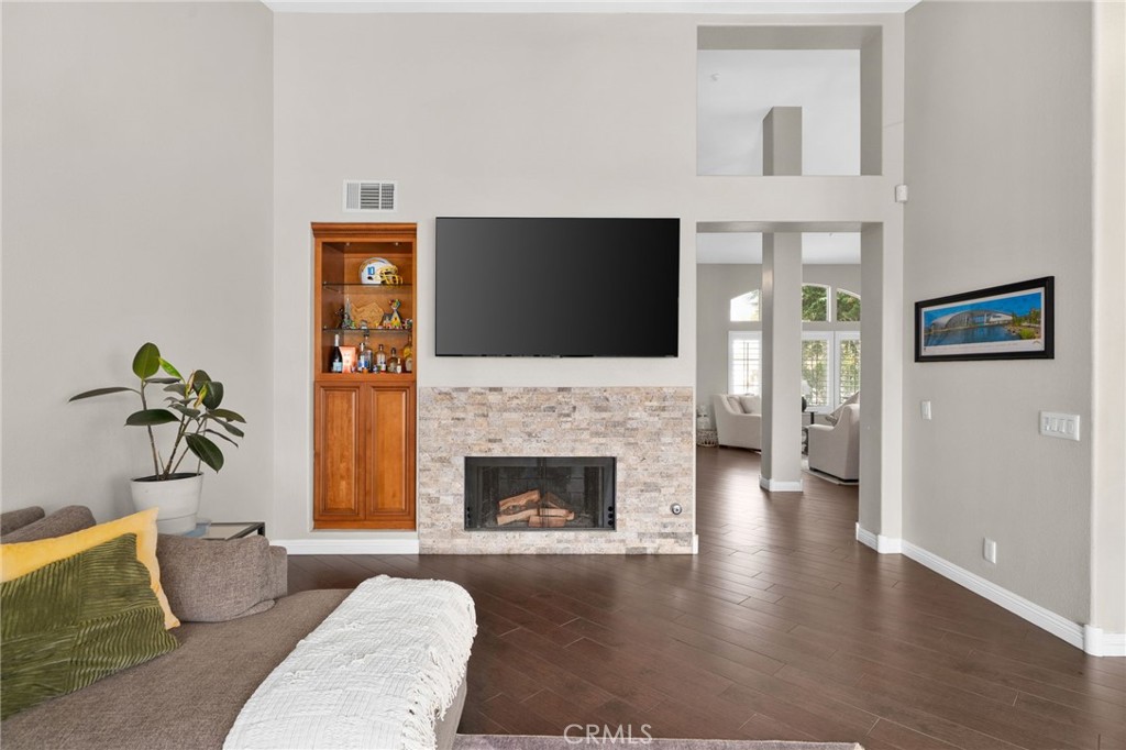 14113 Los Robles Court Rancho Cucamonga, CA 91739 - Photo 11 of 33 a living room with furniture and a fireplace