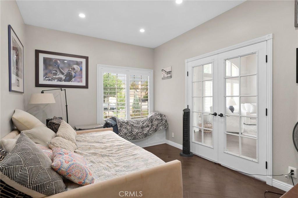 14113 Los Robles Court Rancho Cucamonga, CA 91739 - Photo 17 of 33 a bedroom with a bed and glass windows
