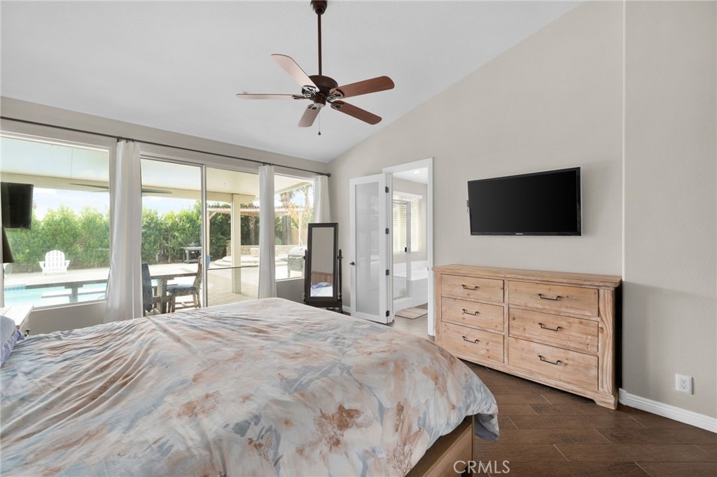 14113 Los Robles Court Rancho Cucamonga, CA 91739 - Photo 20 of 33 a spacious bedroom with a bed and a flat screen tv