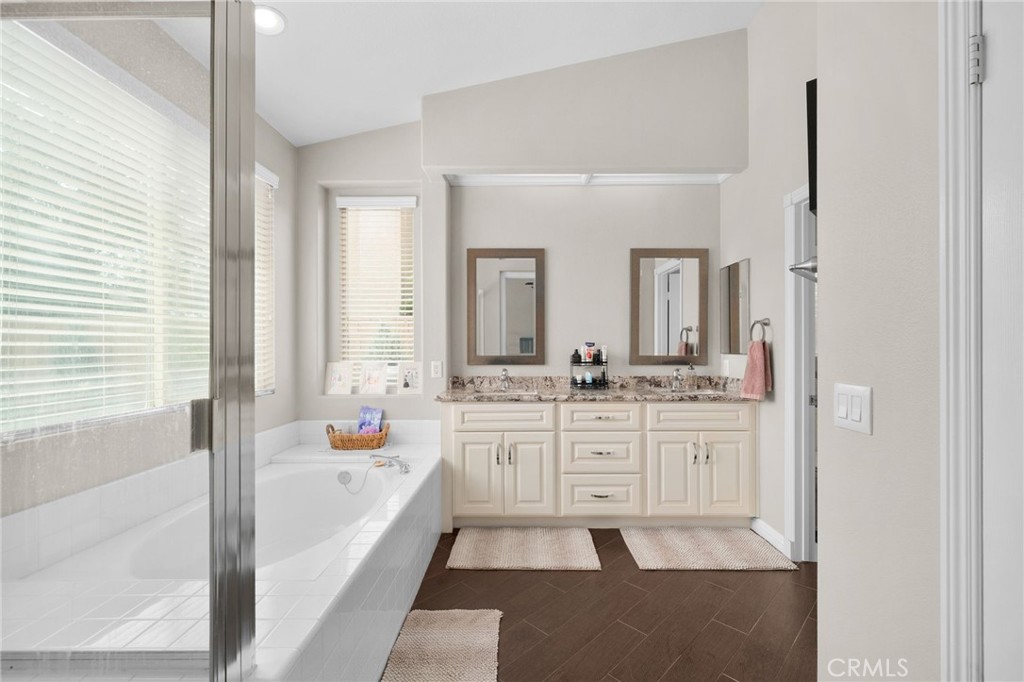 14113 Los Robles Court Rancho Cucamonga, CA 91739 - Photo 22 of 33 a bathroom with a tub sink and mirror